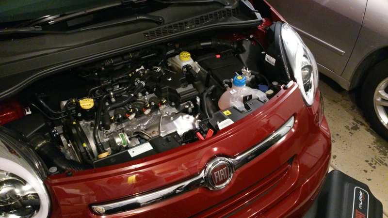 Removing the insulating shroud (surprisingly heavy and partially shown on the floor here), Fiat’s innovative MultiAir head is exposed. Looks like a coil-on-plug setup, too. The engine is a 1.4T paired to FPT’s infamous C635 DDCT.